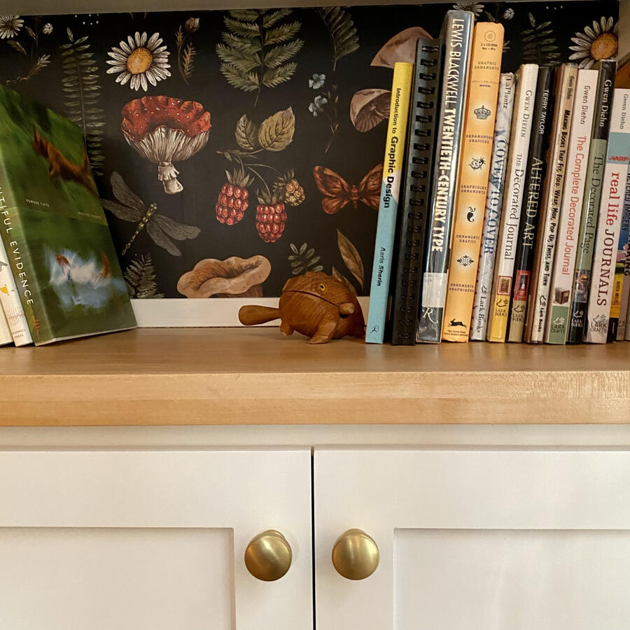 Custom Built-Ins w/ Maple Counter Top, Wallpaper, and Legs w/ Brass details